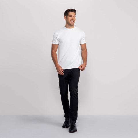 The Jetsetter Tech Pant Straight Fit in True Black on a model.