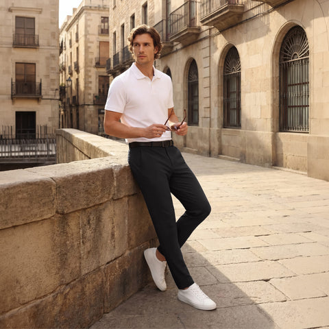 A man wearing the Jetsetter Tech Pant Slim Fit in True Black