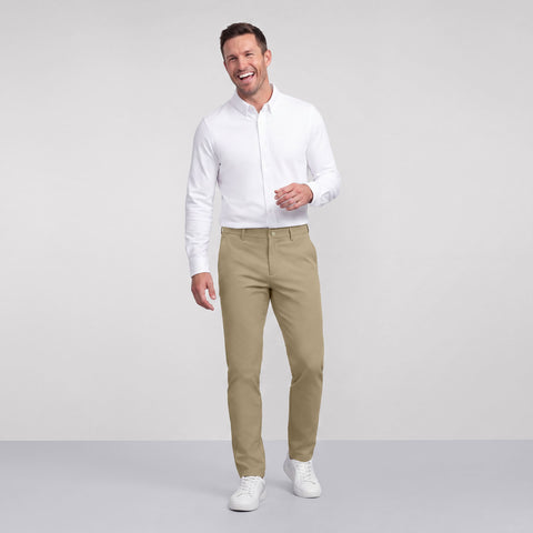 The Jetsetter Tech Pant Straight Fit in True Khaki, worn while sitting
