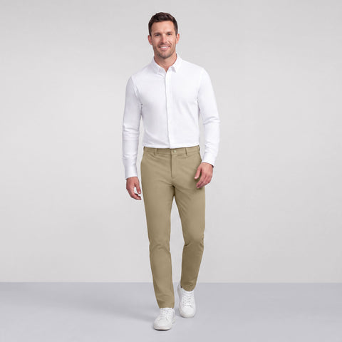 A man in the Jetsetter Tech Pant Straight Fit, True Khaki lifestyle shot