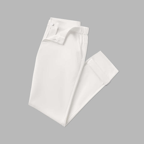 The Jetsetter Tech Pant Slim Fit in True White, folded on white background