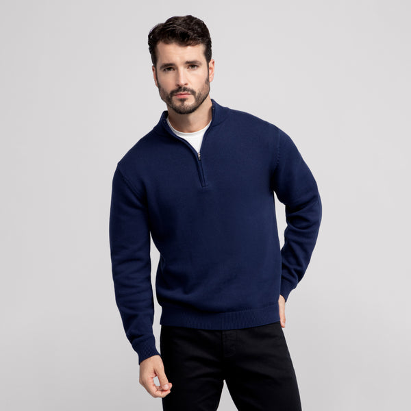 A man wearing the Jetsetter Quarter-Zip Sweater in Navy