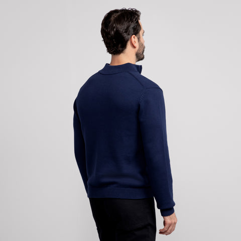 A man wearing the Jetsetter Quarter-Zip Sweater in Navy