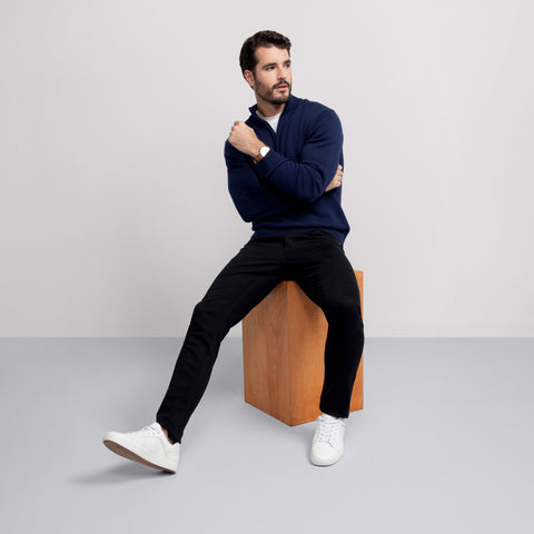A man in the Jetsetter Quarter-Zip Sweater in Navy outdoors