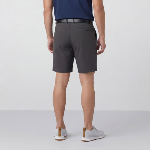 A man in the Jetsetter Tech Short 7 Charcoal Gray, lifestyle shot.