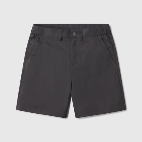 A man wearing the Jetsetter Tech Short 7 in Charcoal Gray outdoors.