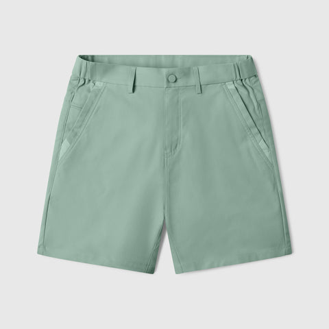 The Jetsetter Tech Short 7 inch in Sage Green, flat lay.