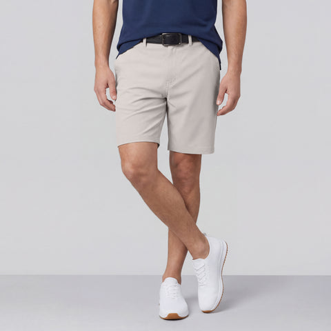 A man wearing the Jetsetter Tech Short 7" in Sand Stone