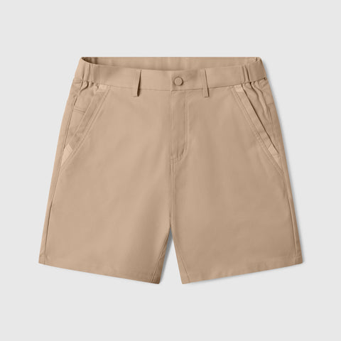 The Jack Archer Jetsetter Tech Short 7" in Sand Tan features belt loops, a front button with zipper closure, and two angled front pockets, shown against a plain white background.