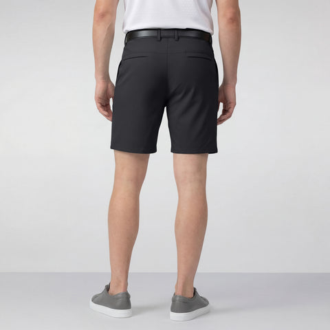 A man wearing the Jetsetter Tech Short 7" in Space Black, outdoor lifestyle shot.