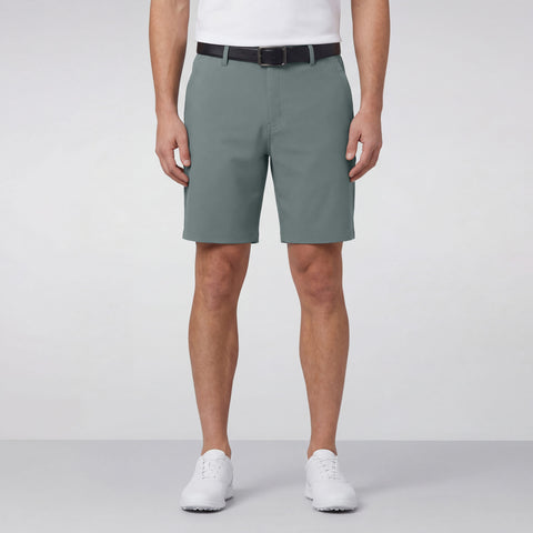 A man wearing the Jetsetter Tech Short 7 inches in Storm Green