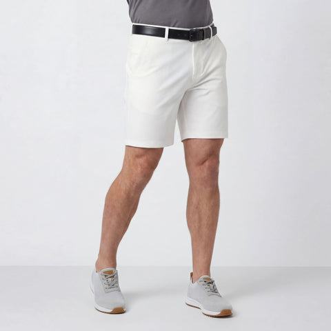 A man wearing the Jetsetter Tech Short 7" in True White