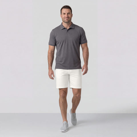 A man wearing the Jetsetter Tech Short 7 inch in True White.