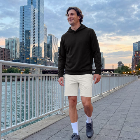 A man wearing the Jetsetter Tech Short 7 inch in True White, lifestyle.