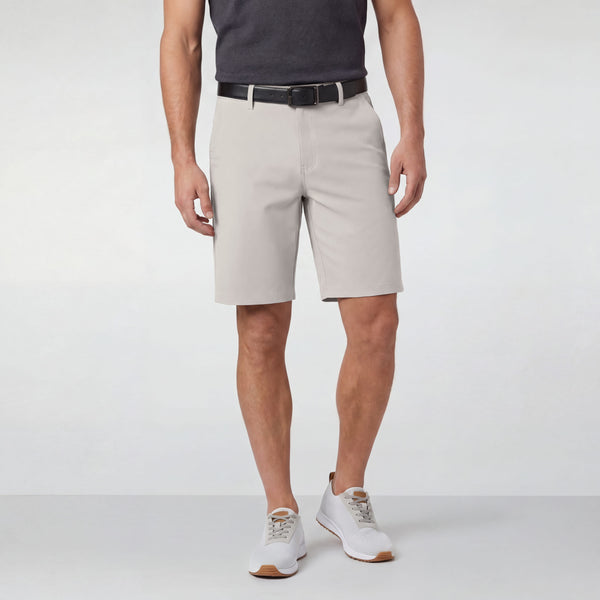 A man wearing the Jetsetter Tech Short 9 inches in Sand Stone
