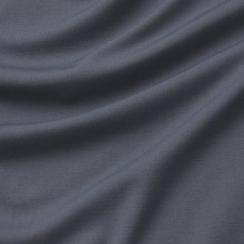 Soft, dark charcoal gray fabric with visible texture and gentle folds forms wavy patterns—perfect for the travel-ready Jetsetter Tee by Jack Archer.