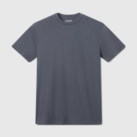 The Jack Archer Jetsetter Tee in Charcoal Gray features a classic crewneck and short sleeves, shown laid flat on a light gray background—ideal for any travel-ready wardrobe.