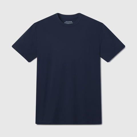 The Jack Archer Jetsetter Tee in Deep Blue features a crewneck and short sleeves, shown flat on a light gray background—ideal for your travel-ready wardrobe.