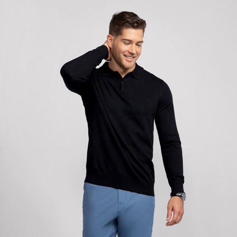 A man wearing the Legacy Polo Sweater in Black