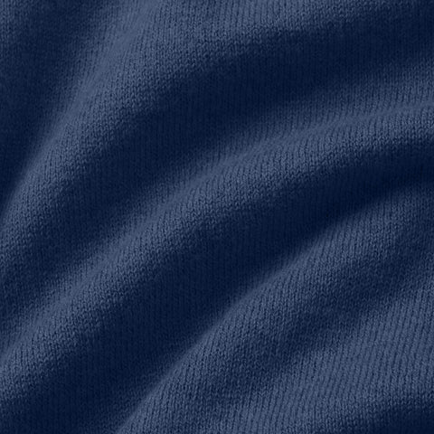 A man wearing the Legacy Resort Polo in Harbor Blue outdoors