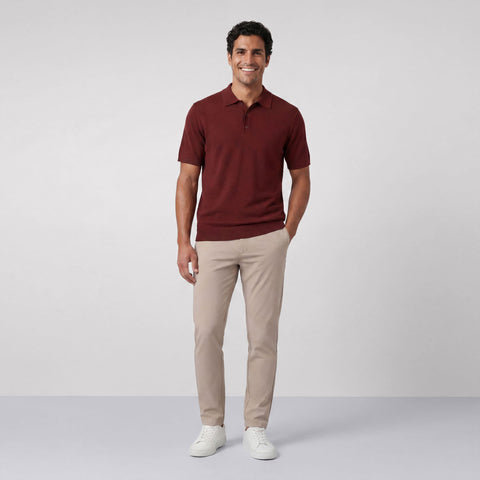 A man wearing the Legacy Resort Polo in Maroon.