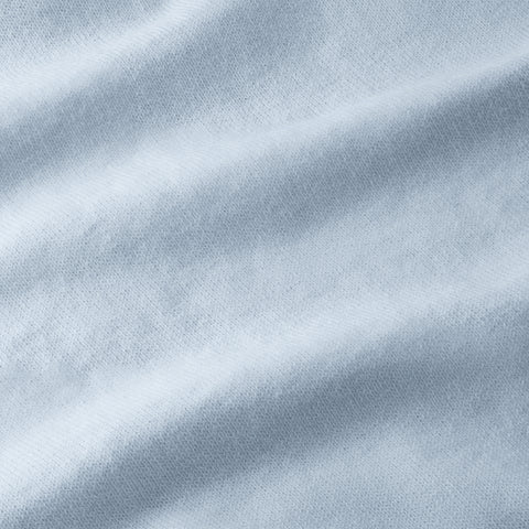 A man wearing the Legacy Resort Polo in Mist Blue