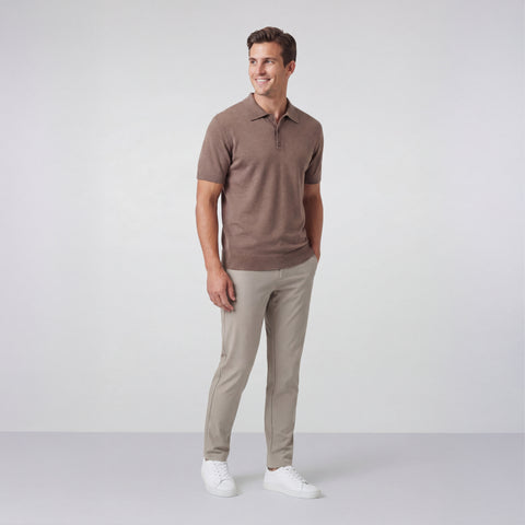 A man wearing the Legacy Resort Polo in Mocha Heather, side view.