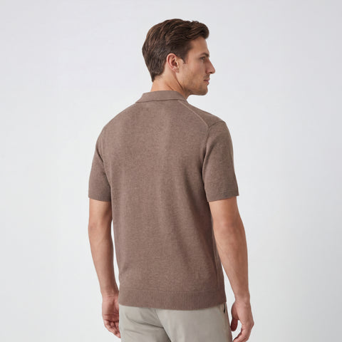 A man wearing the Legacy Resort Polo in Mocha Heather from behind.