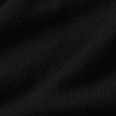 A man in the Legacy Resort Polo True Black outdoors.
