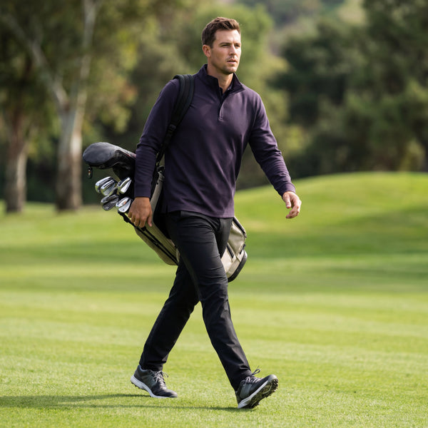 A man wearing the Sandwash Quarter-Zip in Deep Blue against a neutral background