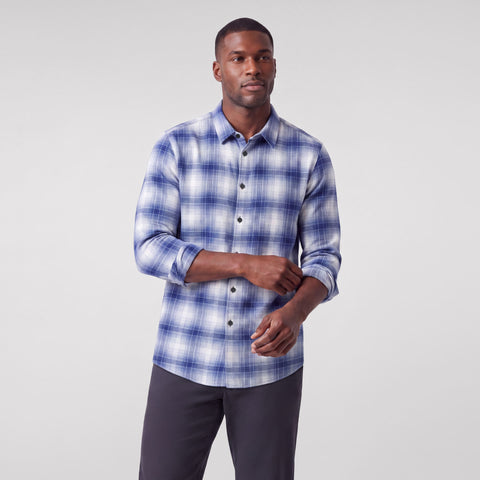 A man wearing the Anytime Plaid Shirt in Navy Classic Plaid
