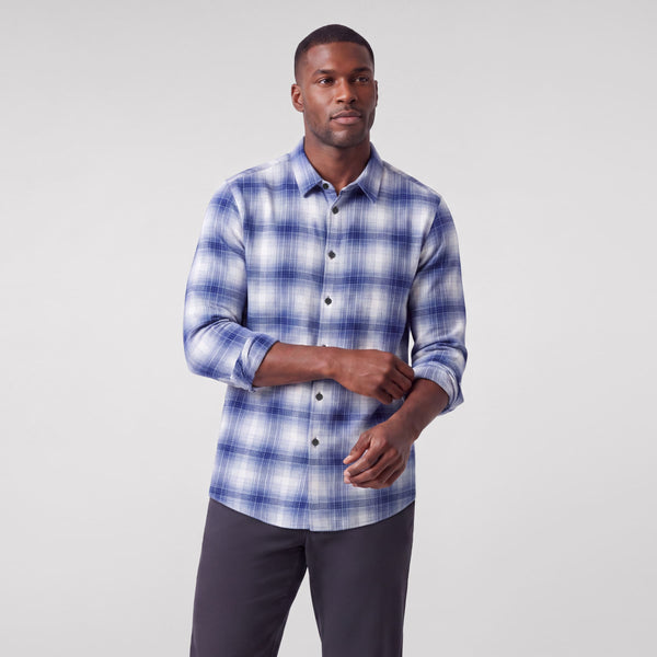 A man wearing the Anytime Plaid Shirt in Navy Classic Plaid