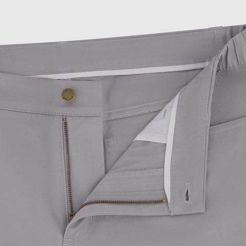 A man in the Charter Twill Pant, Granite, seated