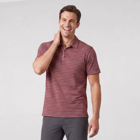 A man wearing Jack Archer Clubhouse Performance Polo in Maroon Stripe against a light background.