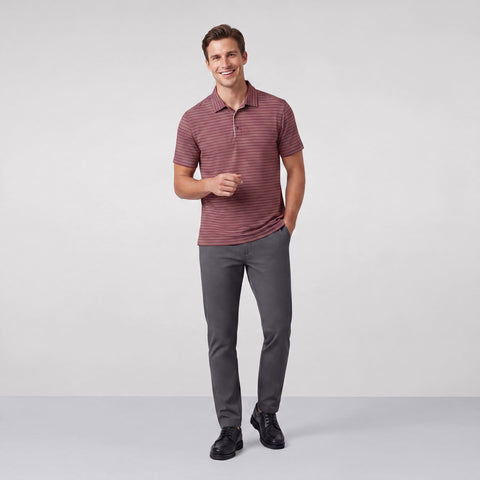 Alternate angle of a man in the Clubhouse Performance Polo, Maroon