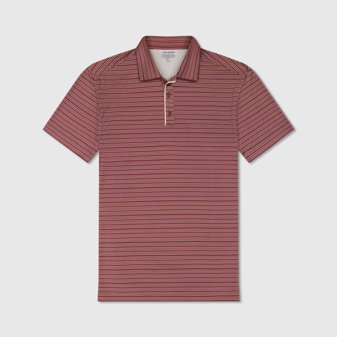 A man in the Clubhouse Performance Polo, Maroon Stripe, seated
