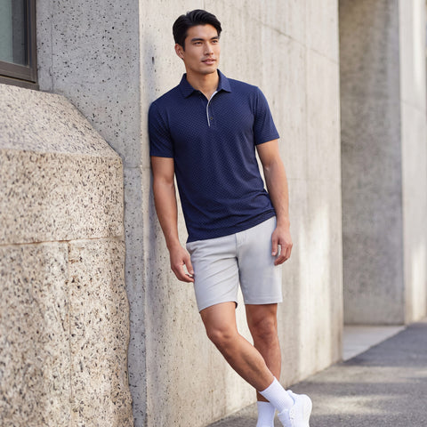 The Clubhouse Performance Polo in Navy Micro Dot, outdoor lifestyle view