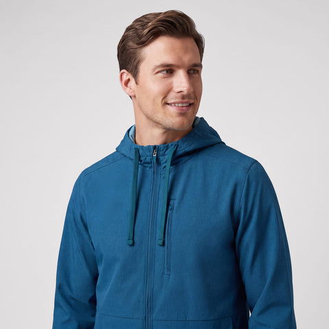 The Clubhouse Range Hooded Jacket in Pacific Blue shown from the side