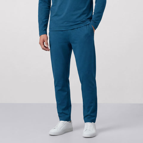 A man wearing the Clubhouse Range Jogger in Pacific Blue