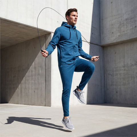 A man wearing the Clubhouse Range Jogger in Pacific Blue in action