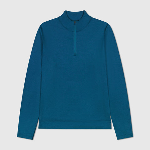 A man wearing the Clubhouse Range Quarter-Zip in Pacific Blue in motion