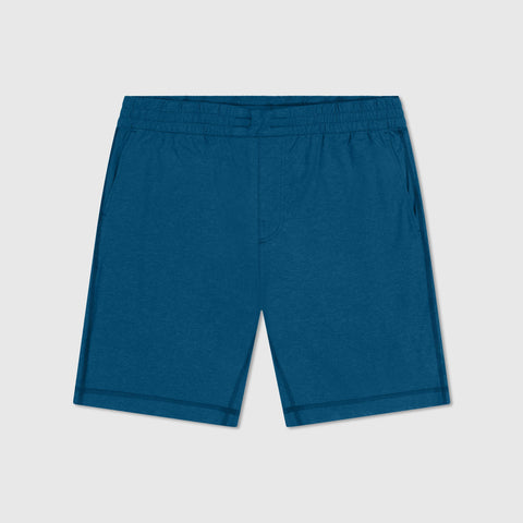 A man wearing the Clubhouse Range Short 7" in Pacific Blue in action