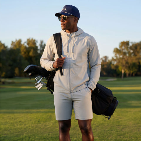 A man wearing the Clubhouse Range Short 7" in Vapor Gray in action