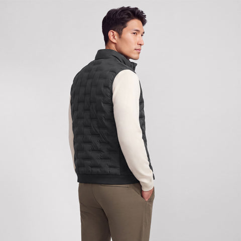 Black quilted Drive vest shown from the back on a model.