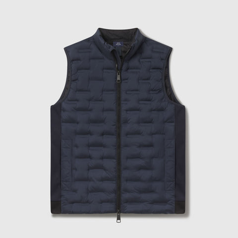 Deep blue quilted Drive vest shown flat from the front.