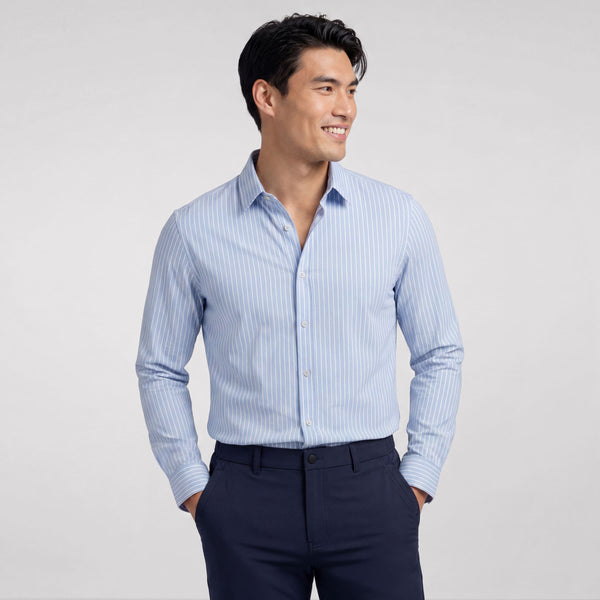A man wearing the Everywear Shirt Standard Length in Fine Stripe with a button-down collar.
