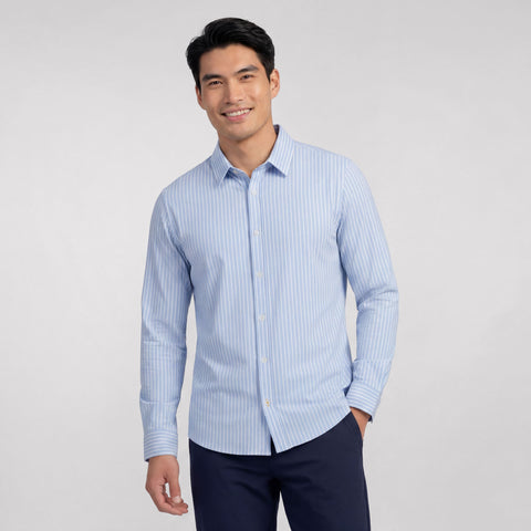 A man wearing the Everywear Shirt Shorter Length in Fine Stripe with a classic fit.