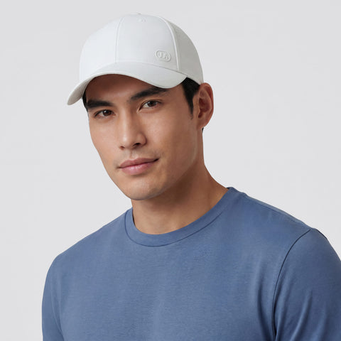 A man wearing the Club Performance Hat in White
