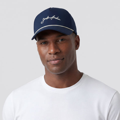 A man wearing the Archer Signature Hat in Navy