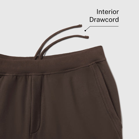 Close-up of the waistband on espresso brown sweatpants, labeled Interior Drawcord.